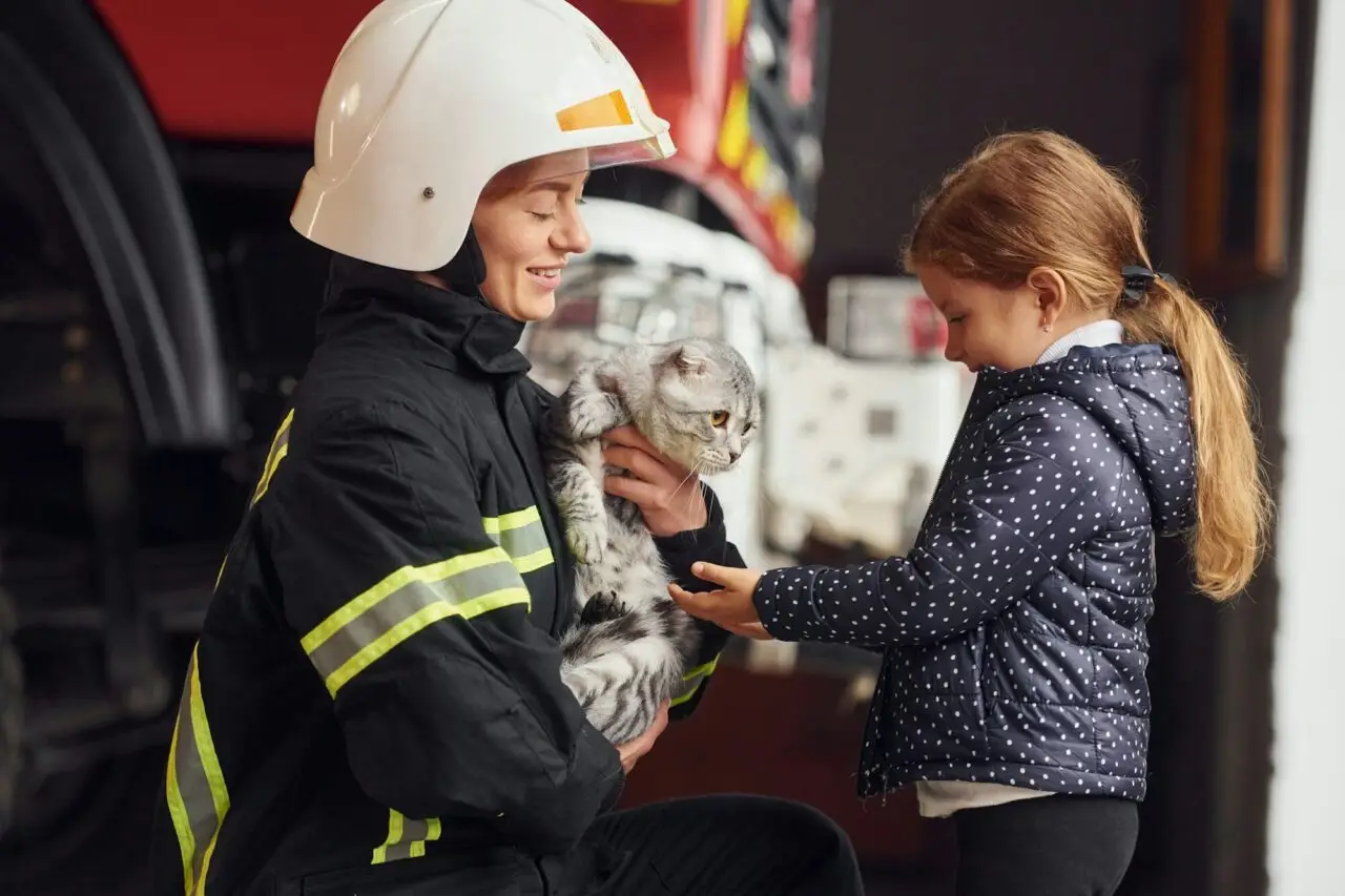 rescued-scottish-fold-cat-firefighter-woman-in-uniform-is-with-a-little-girl.jpg